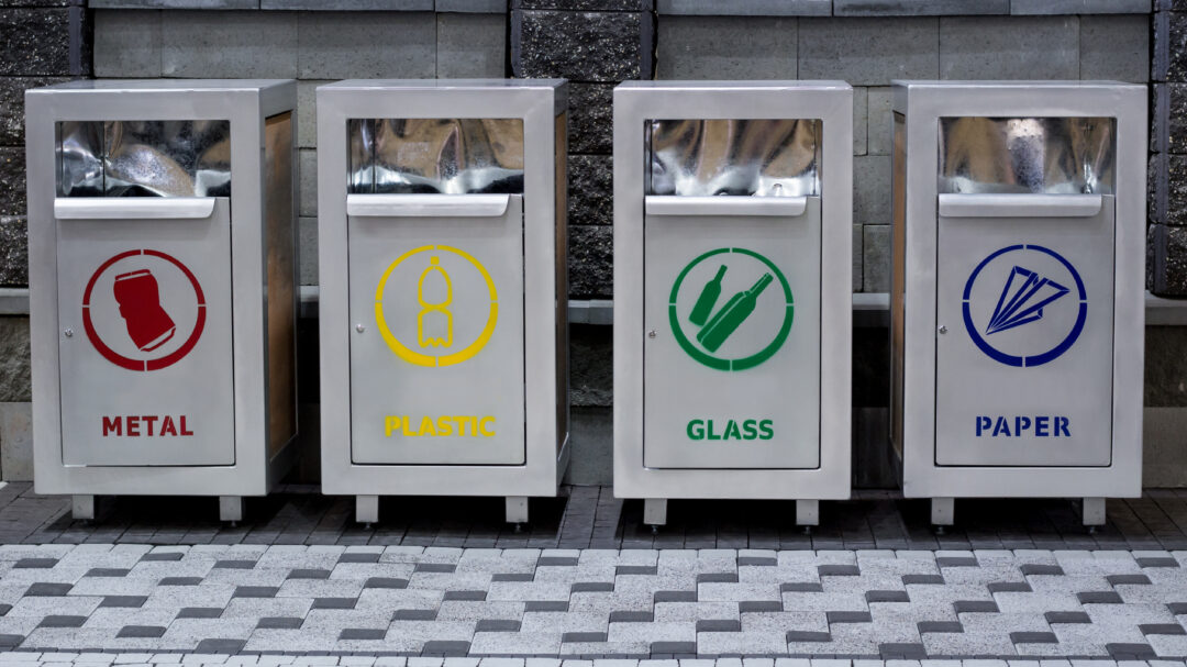 Recucling urban trash containers separating garbage: plastic, paper, metal, glass